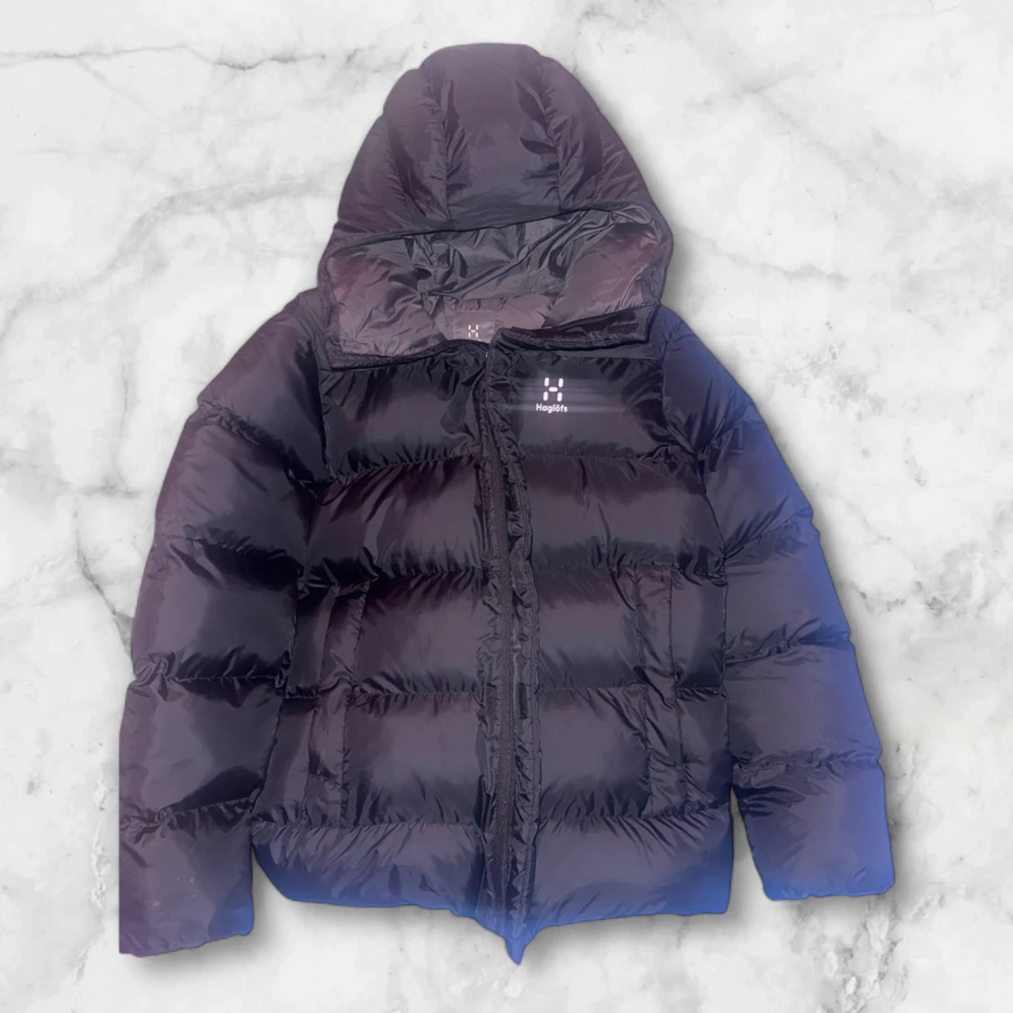 Svart dunjacka från Haglöfs med huva