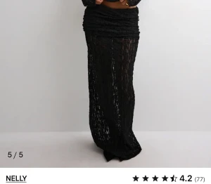 SÖKER !!!!Svart långkjol i spets från Nelly - SÖKER!!!!  en svart långkjol från Nelly med transparent spetsmaterial 