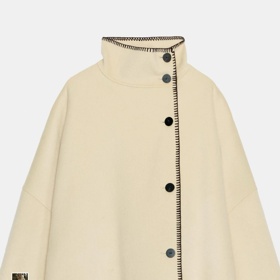 Beige kappa med svarta knappar - 1