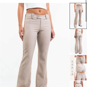 Bonnie 03Low Bootcut Kostymbyxor - Snygga beiga byxor med låg midja och bootcut-ben. Byxorna har bälteshällor, dekorativa ficklock bak och stängs med knapp och dragkedja. Byxorna är från madlady, helt oanvända bara testat dom på säljer dom för de ej passade på mig men super fin byxa. Storlek 38 i reg