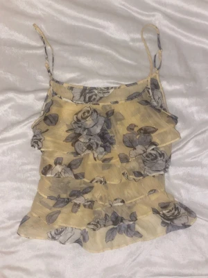 floral frill topp - Adorable top from vintage designer guy laroche! Fits like size S even tho the tag says L 🤍🤍 There is one hole underneath a layer of fabric so you can’t see it when wearing!! 🫶🏻