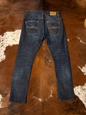 Selvage Nudie GrimTim - Tjena! Säljer dessa riktigt feta Selbage Nudies, modellen är GrimTim och sitter slim, W31/L32, hör av dig vid funderingar!🙌