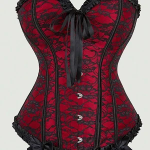 Röd och svart spetskorsett med rosetter - Säljer en snygg korsett i rött med svart spets och dekorativa rosetter. Den har snörning och knappar framtill, samt svarta volangdetaljer längs kanterna. Perfekt för dig som vill sticka ut med en edgy och feminin look. Från shein i Storlek XS