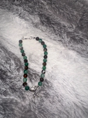 "green-brown.ring" - Namn "green-brown.ring" artikel nummer ”075Q” 15 cm passar alla 