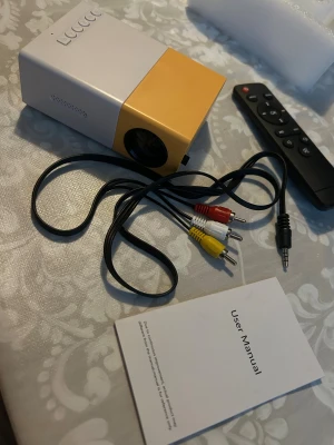 Mini Projector - Mini Projector , works via cables or HDMI. All you get is in the picture, with box.