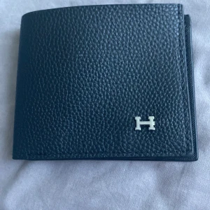 Plånbok från H - H plånbok nyttskick
