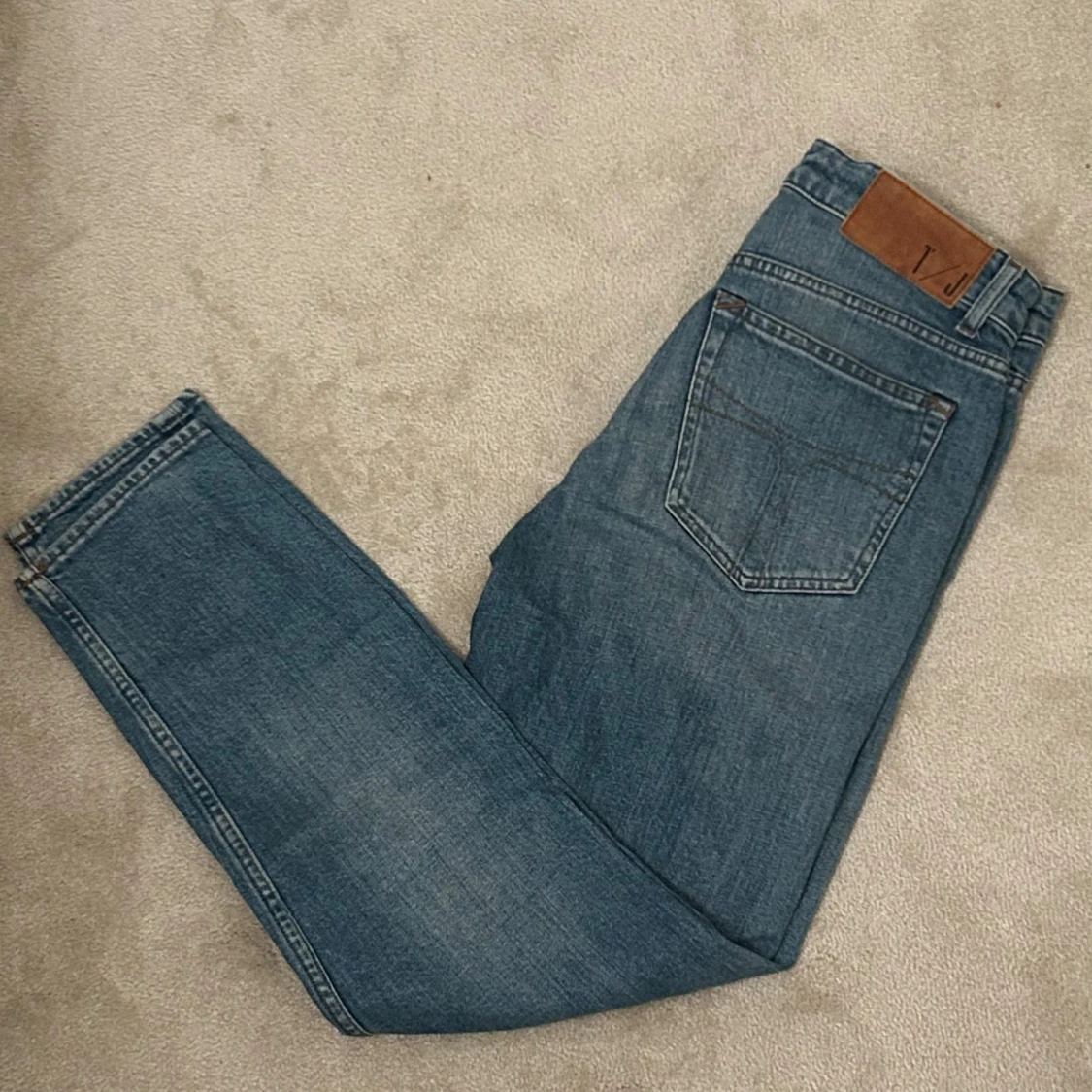 Blå jeansbyxor från tiger of Sweden 27/32