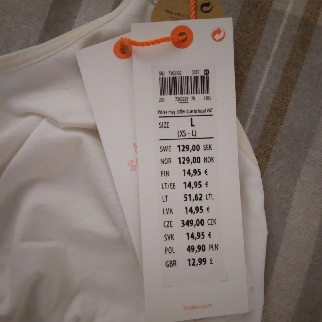 HELT NY OANVÄND vit sporttopp med korsade axelband Lindex, Strlk ca 34-36. - 2