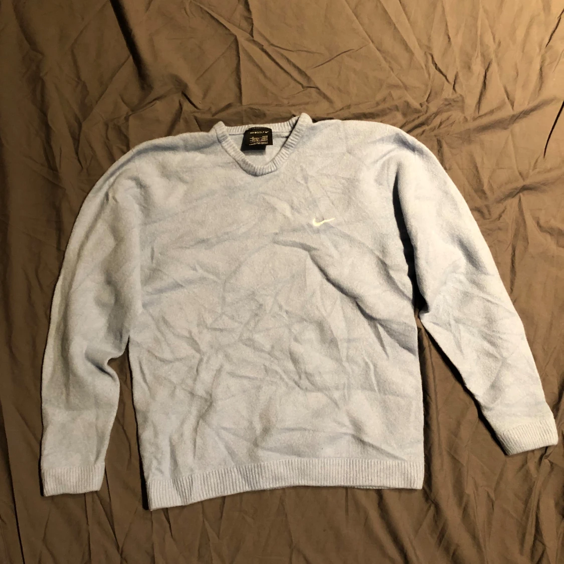 Ljusblå stickad tröja från Nike Golf