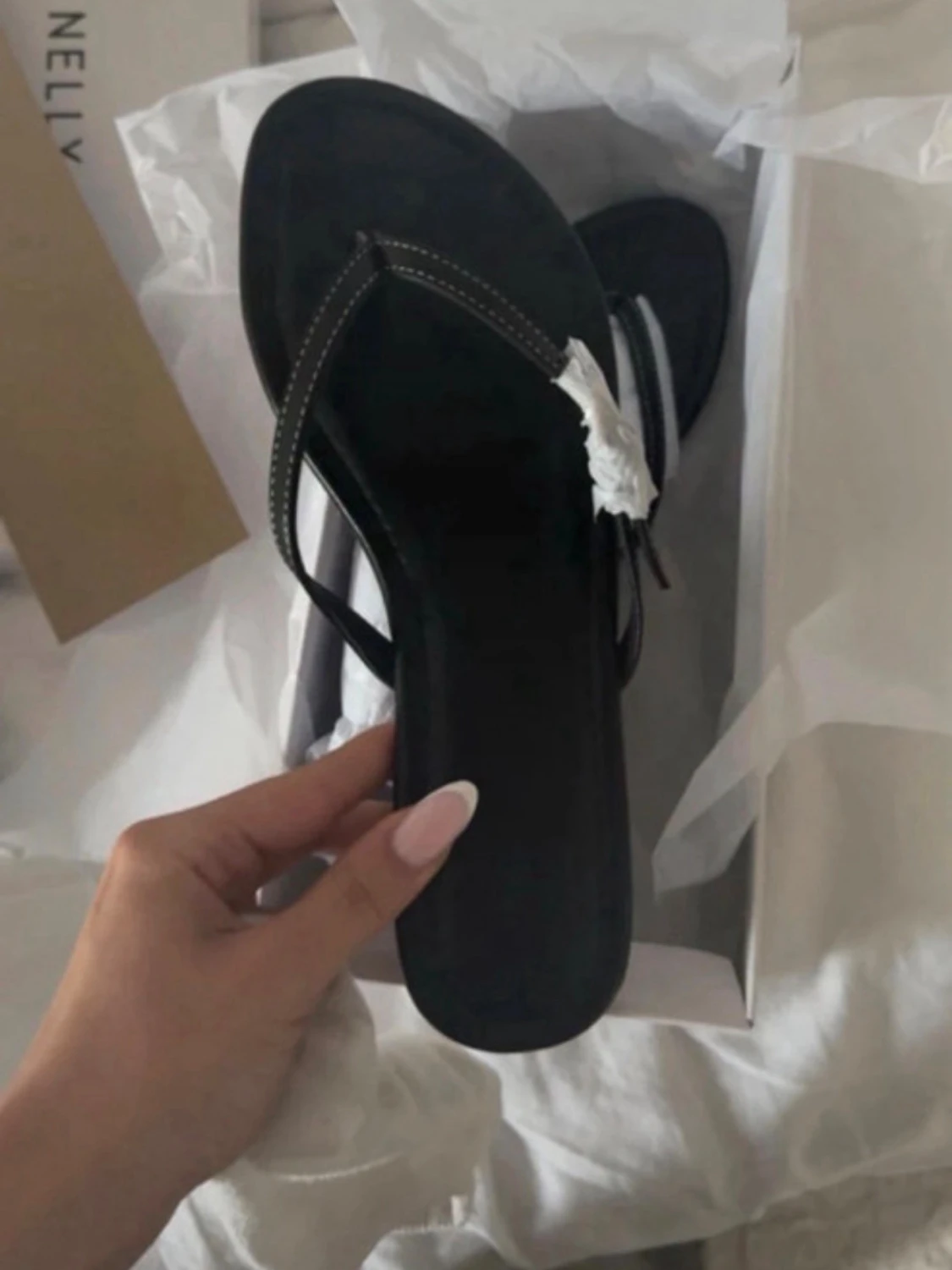 Svarta flip-flop sandaler