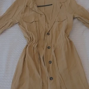 Beige Kappa - Super fin beige kappa, fint att använda när man går ut och det😊