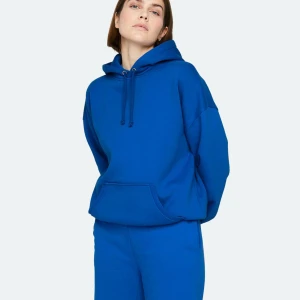 Hoodie - Blå Hoodie från bikbok som är använd fåtal gånger då jag ej gillar färgen, den är lite oversized men passar mig som har S i vanliga fall