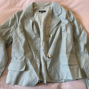 Turquoise spring jacket - I have worn this a bunch, it has served me well. A button is missing in the middle but it is not hugely noticeable
