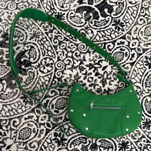 Grön handväska från H&M. Aldrig använd