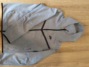 Grey Nike tech hoodie  - It is used and a little damage on the back