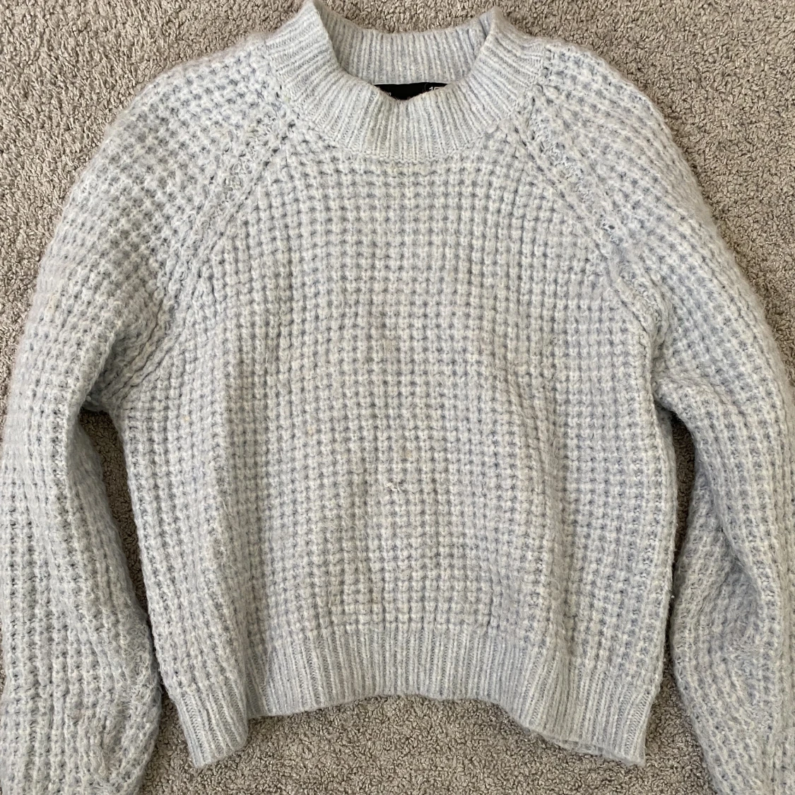 Ljusblå stickad tröja