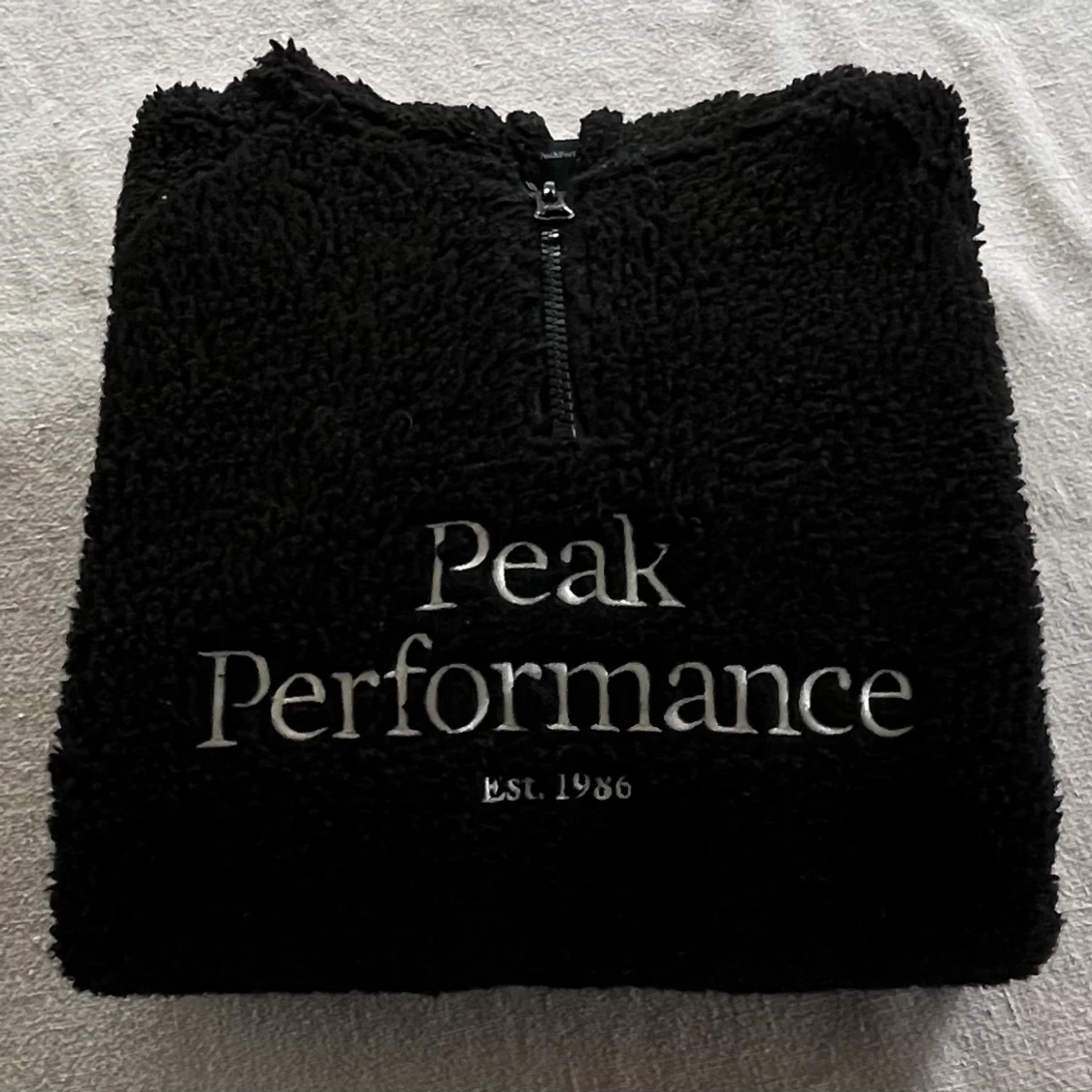 Pile hoodie från Peak Performance  - 91