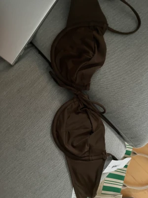 Bikini topp gina - Helt ny bikini överdel från Gina! Den är mörkbrun! 