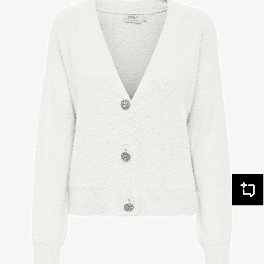 Vit kofta med silver knappar