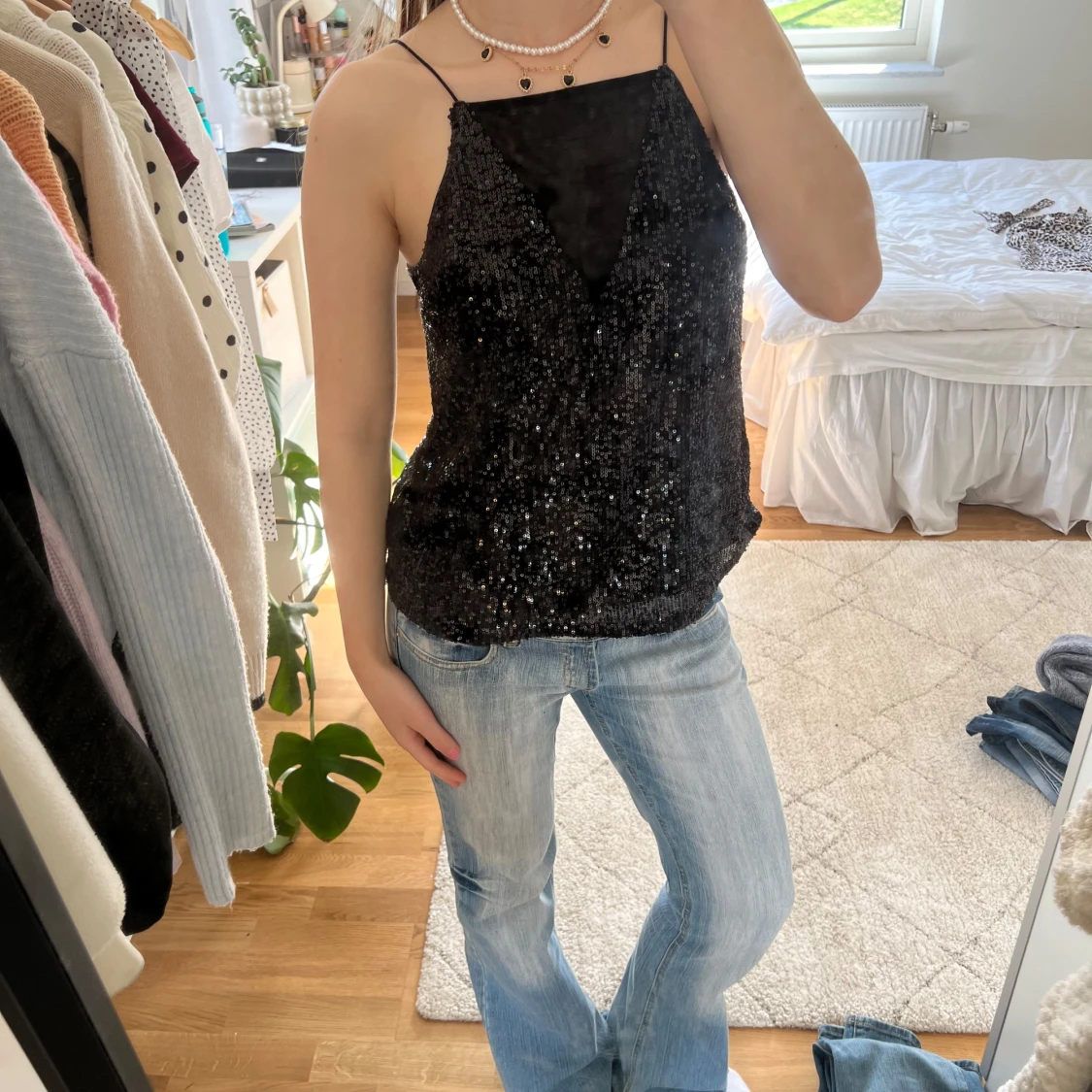 Glittrig svart topp