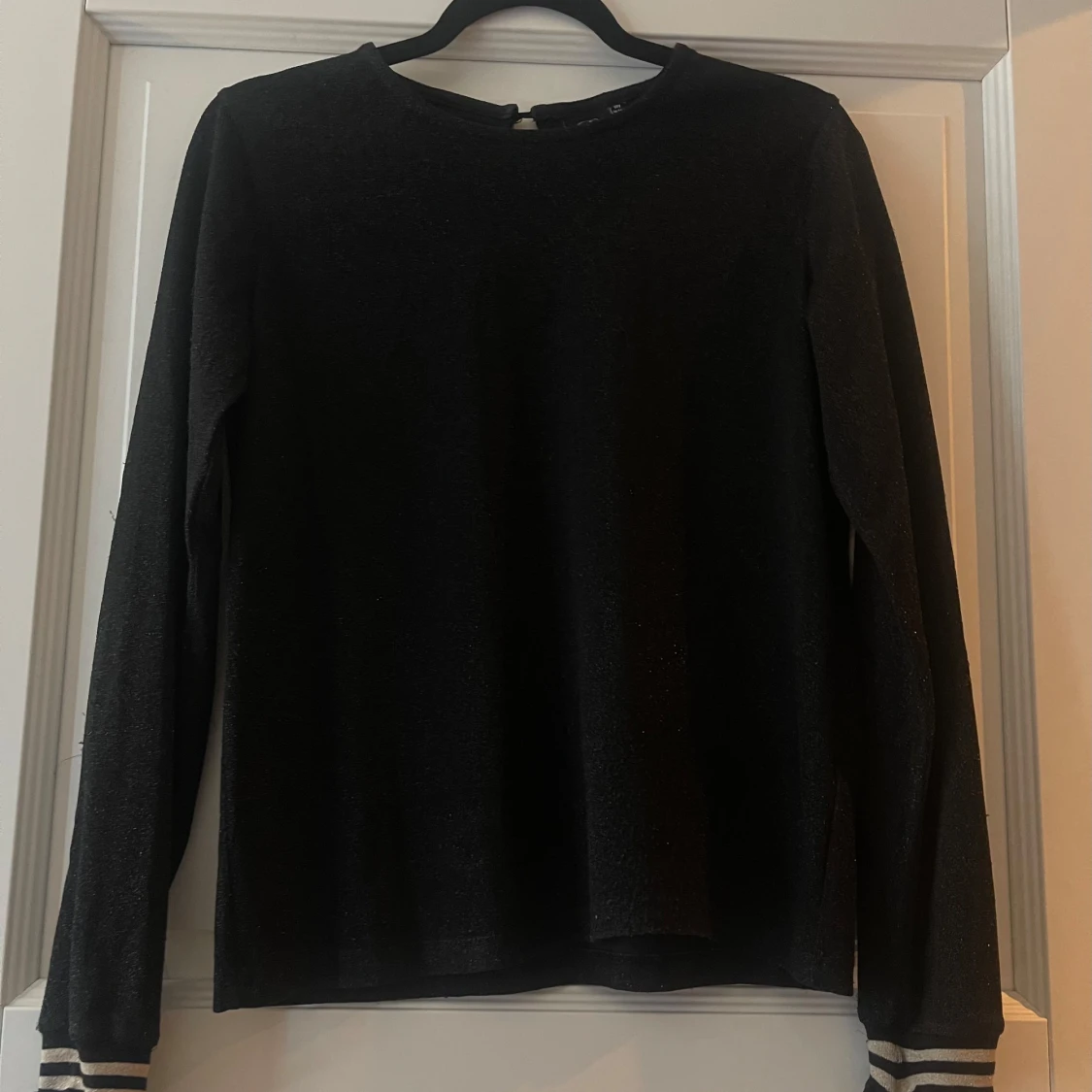 Svart glittrig långärmad topp från Petit by Sofie Schnoor