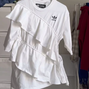 Adidas x JKoo ruffle shirt - Adidas X J Koo ruffle shirt. Never worn brand new.  