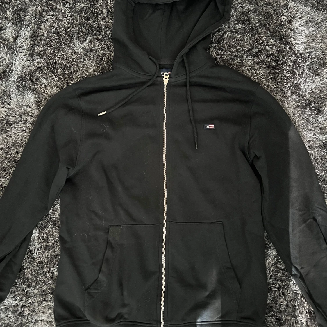 Svart hoodie från Lexington med dragkedja