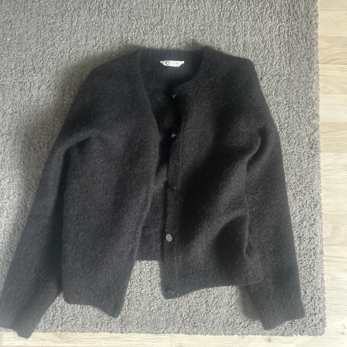 Svart kofta i ull - 1