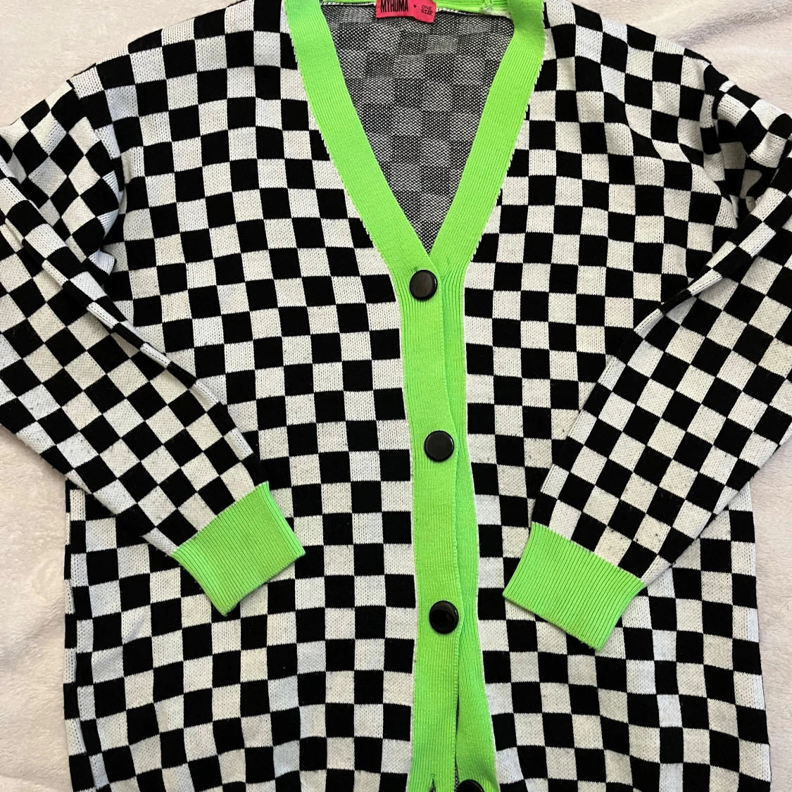 Svartvit rutig kofta med neon grönt