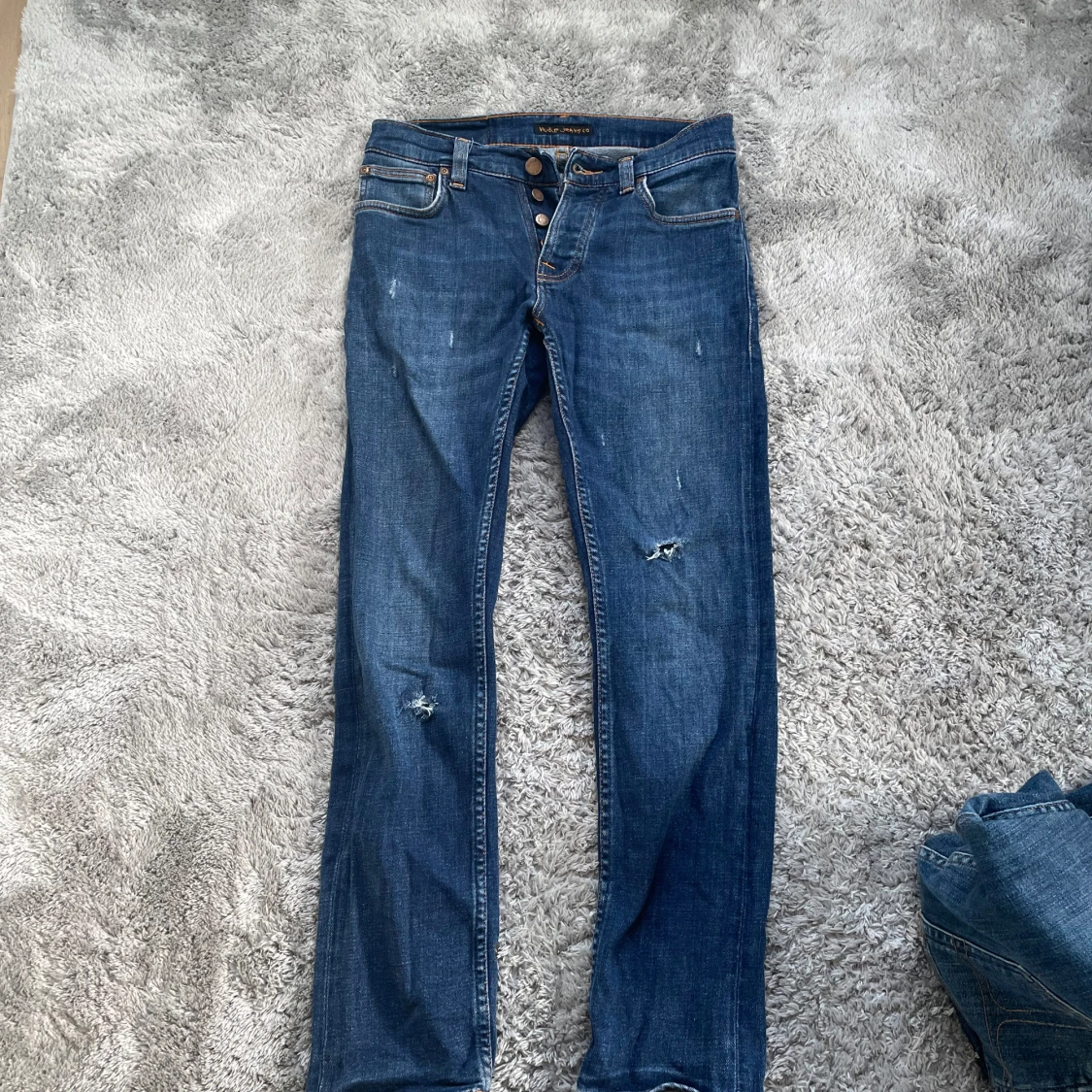 Blå jeans från Nudie Jeans, W27 L28