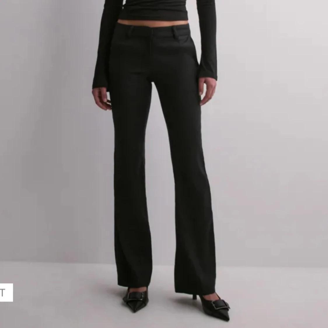 Svarta kostymbyxor