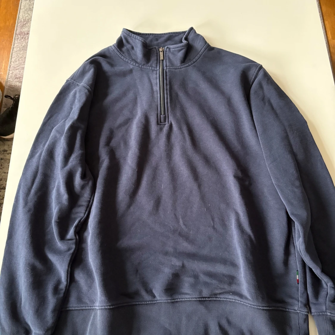 Mörkblå half zip tröja från Strömberg