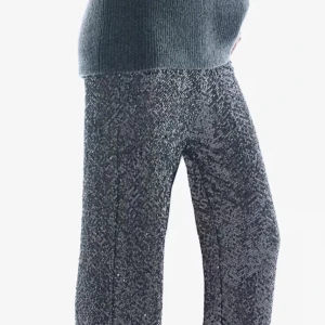 Glittriga byxor i svart och silver - Snygga glittriga byxor i svart och silver med ett mönster som ger en unik look. Byxorna har en loose passform och är perfekta för att sticka ut.