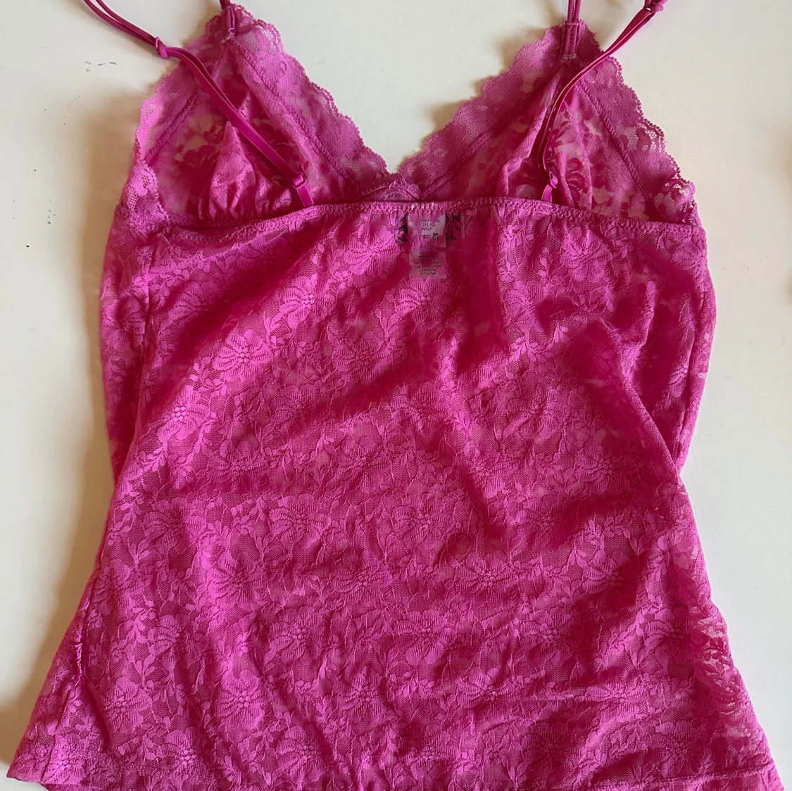 Rosa spetslinne med rosett - 1