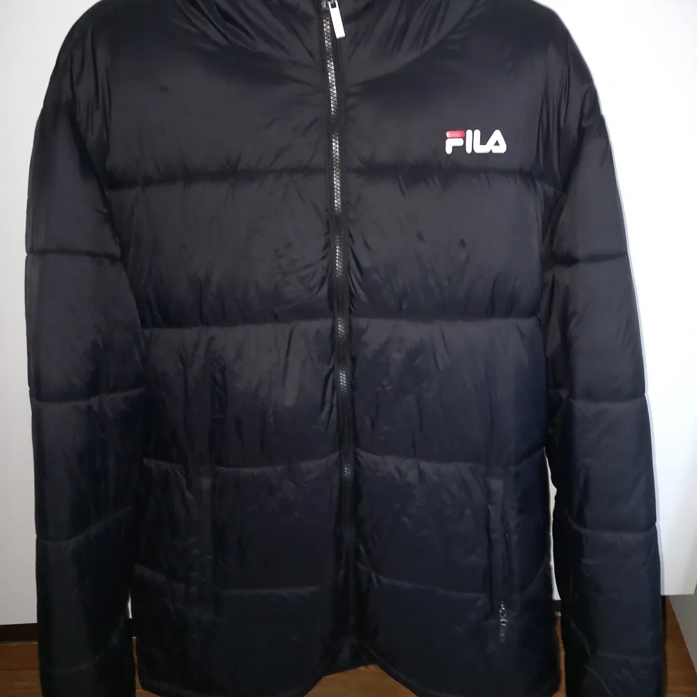 Fila Vinterjacka XL. Varm och skön, använd sparsamt.. Jackor.