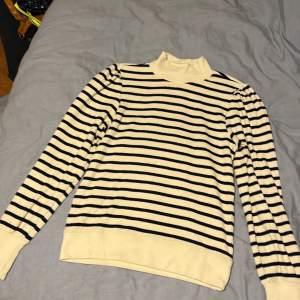 Size S Super soft Barely worn  Beige and navy stripes 