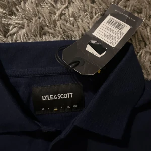 Lyle scott piké aldrig använd  - Piké från lyle scott aldrig använd med prislapp