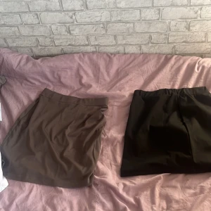 Kjolar - 1 svart och en grå kjol, använder ej