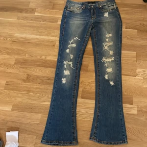 Snygga bootcut jeans - Snygga äkta cavalli jeans med snygga håll 