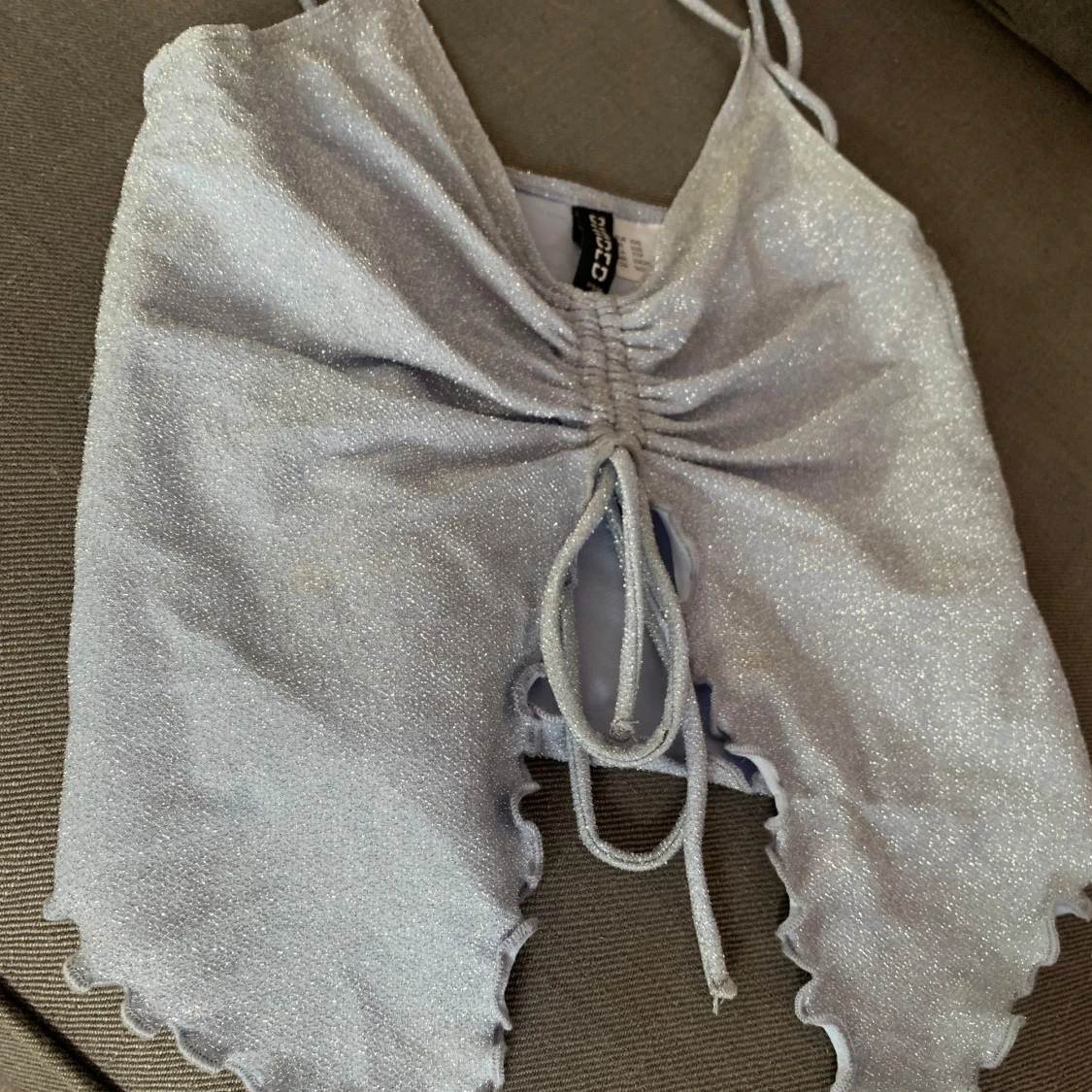 Ljusblå glittrig topp