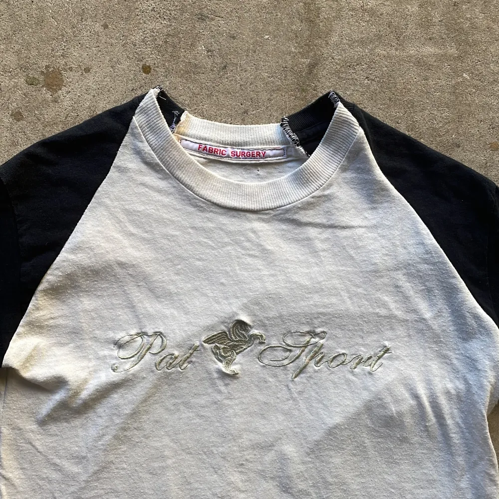 Crafted from a trio of vintage T-shirts, expertly combined in the timeless raglan cut, each shirt thoughtfully selected to form this unique piece.. T-shirts.