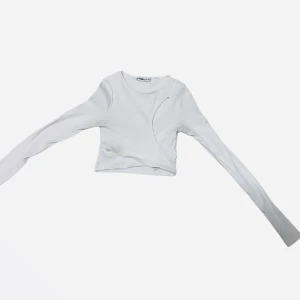 Vit New Yorker Långärmad - En vit New Yorker tröja med storleken XS.