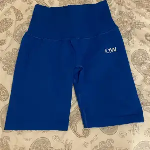 ICIW shorts, same fit as the second picture. You can pull them up and work with them to make them shorter. 