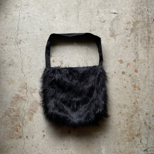 Fur Side Bag - Crafted from a soft fur fabric featuring a leather bottom