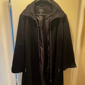 Kappa  - Svart kappa i bra skick