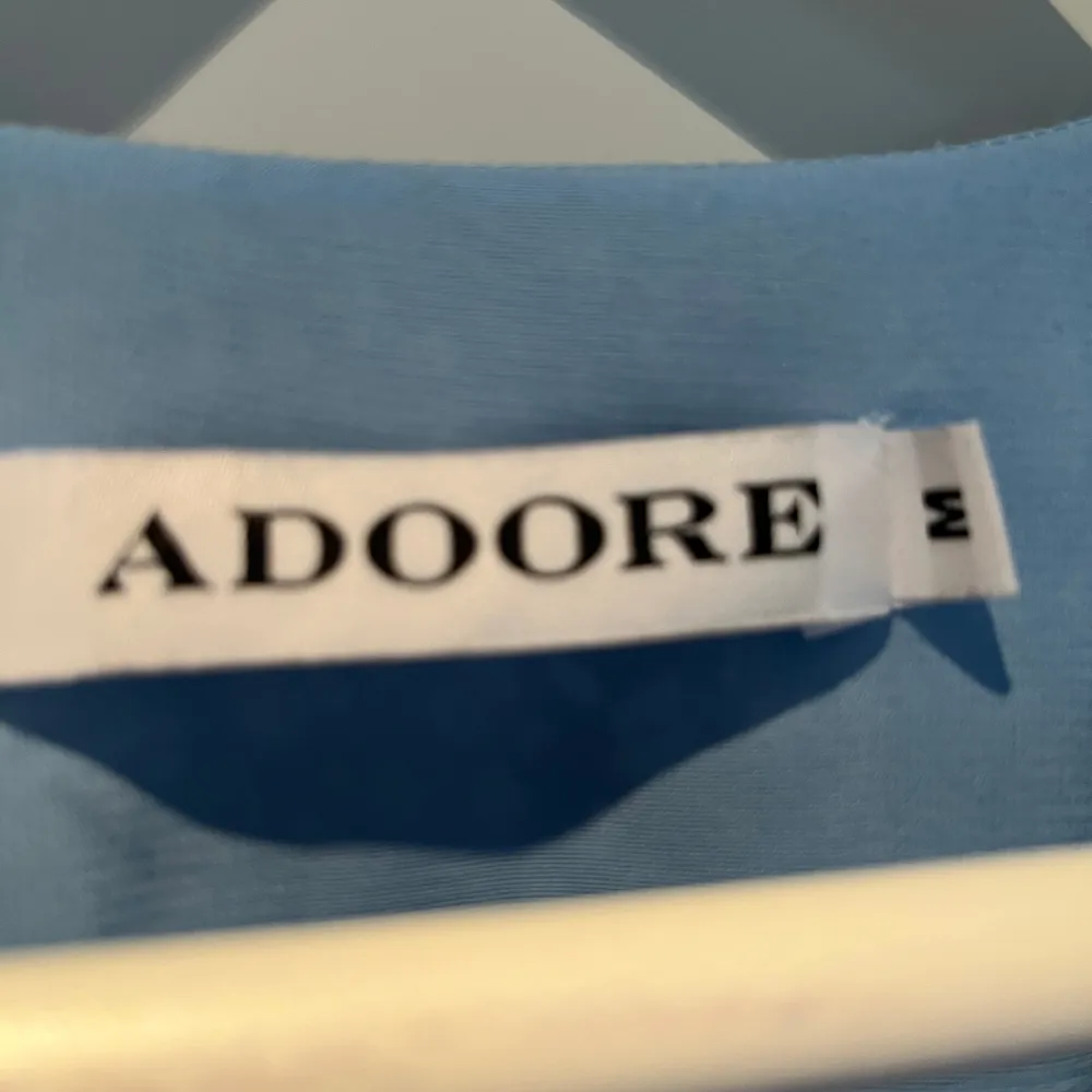 Klänning ljusblå från Adoore i mycket fint skick, använd ett fåtal gånger. Stl M. . Klänningar.