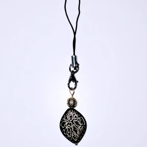 Svart accessoar till tex mobil/kläder - Svart akrylpärla med guldspringor, guldig metallpärla med glittrigt bling.