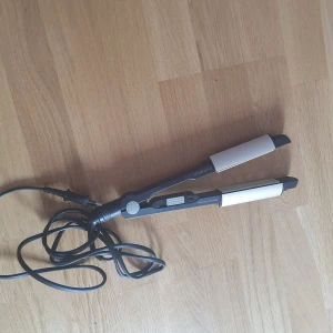 Babyliss titanium ceramic icurl pro230 - Babyliss titanium ceramic icurl pro230, works as a curling iron and a flatiron. 