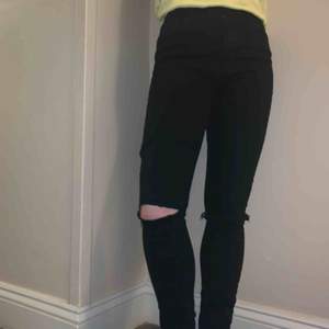 Black ripped knee stretch jeans. Size 26, but fits very small like a 24-25 