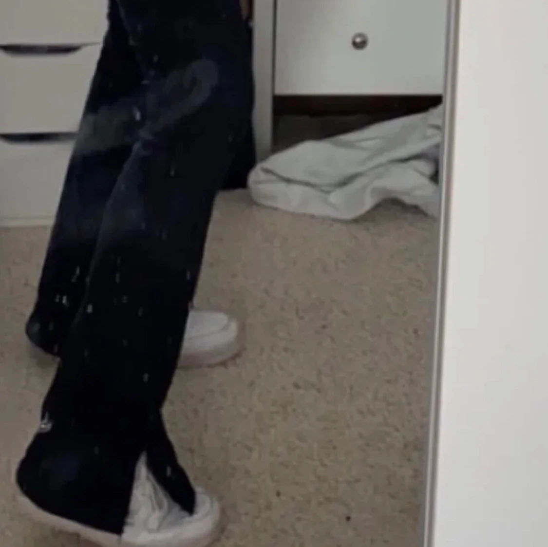 Svarta jeans med split